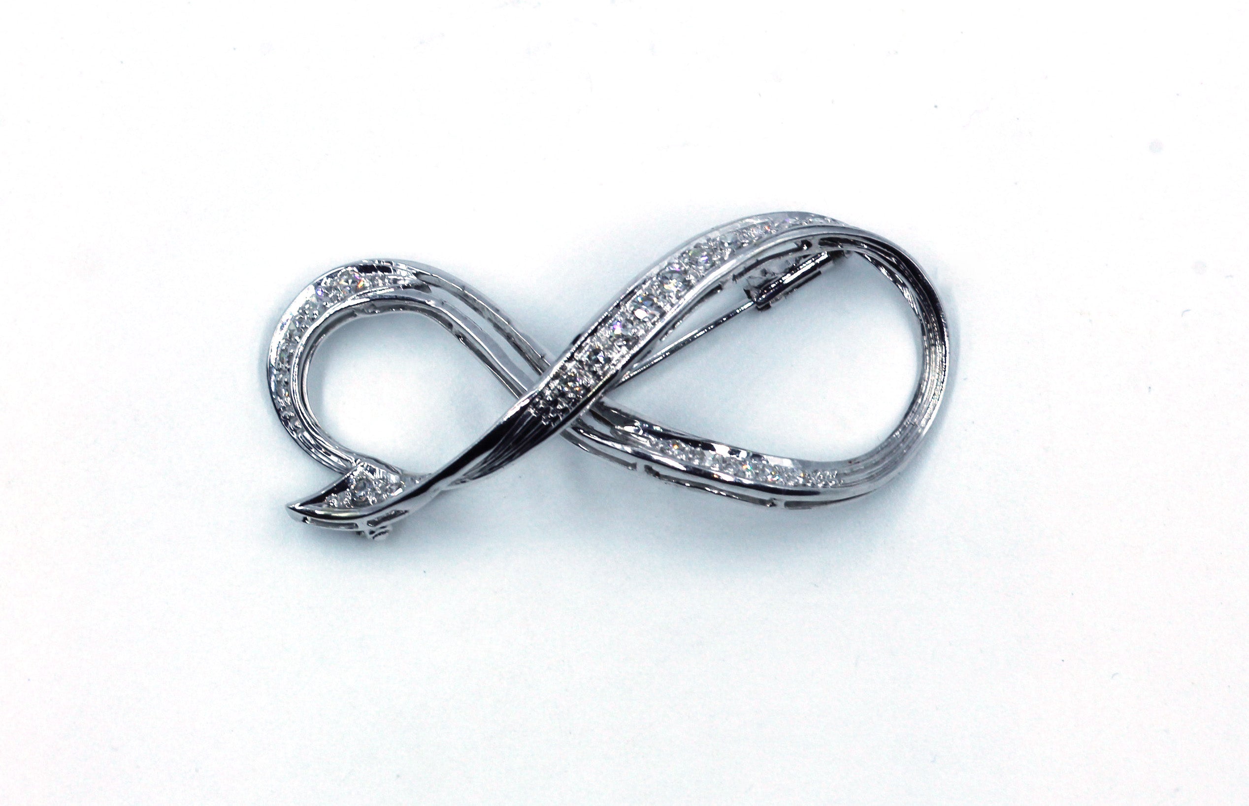 Infiny Pin Vintage Diamond Infinity Pin, SOLD – Deleuse Fine Jewelry